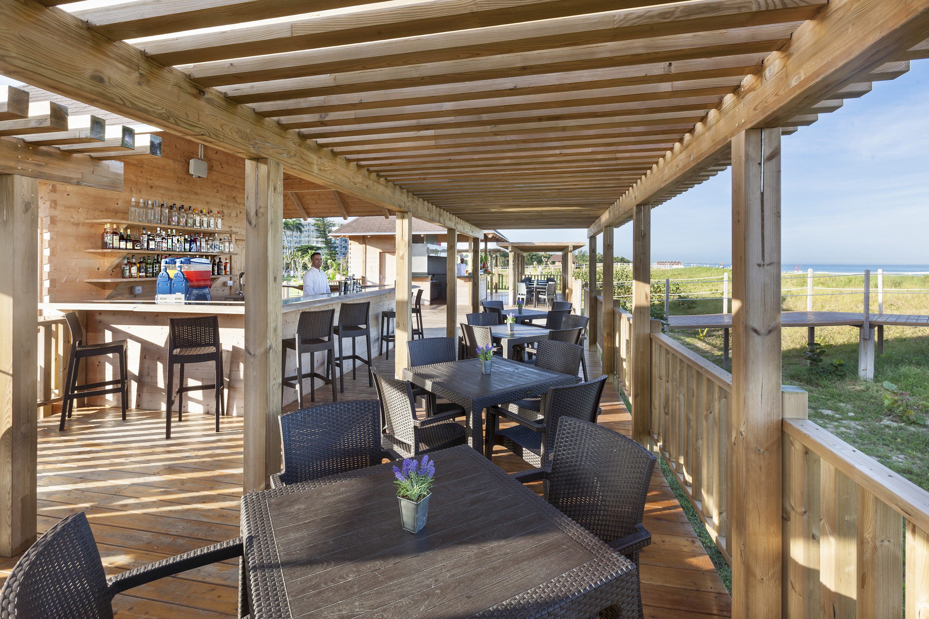 a patio with tables and chairs