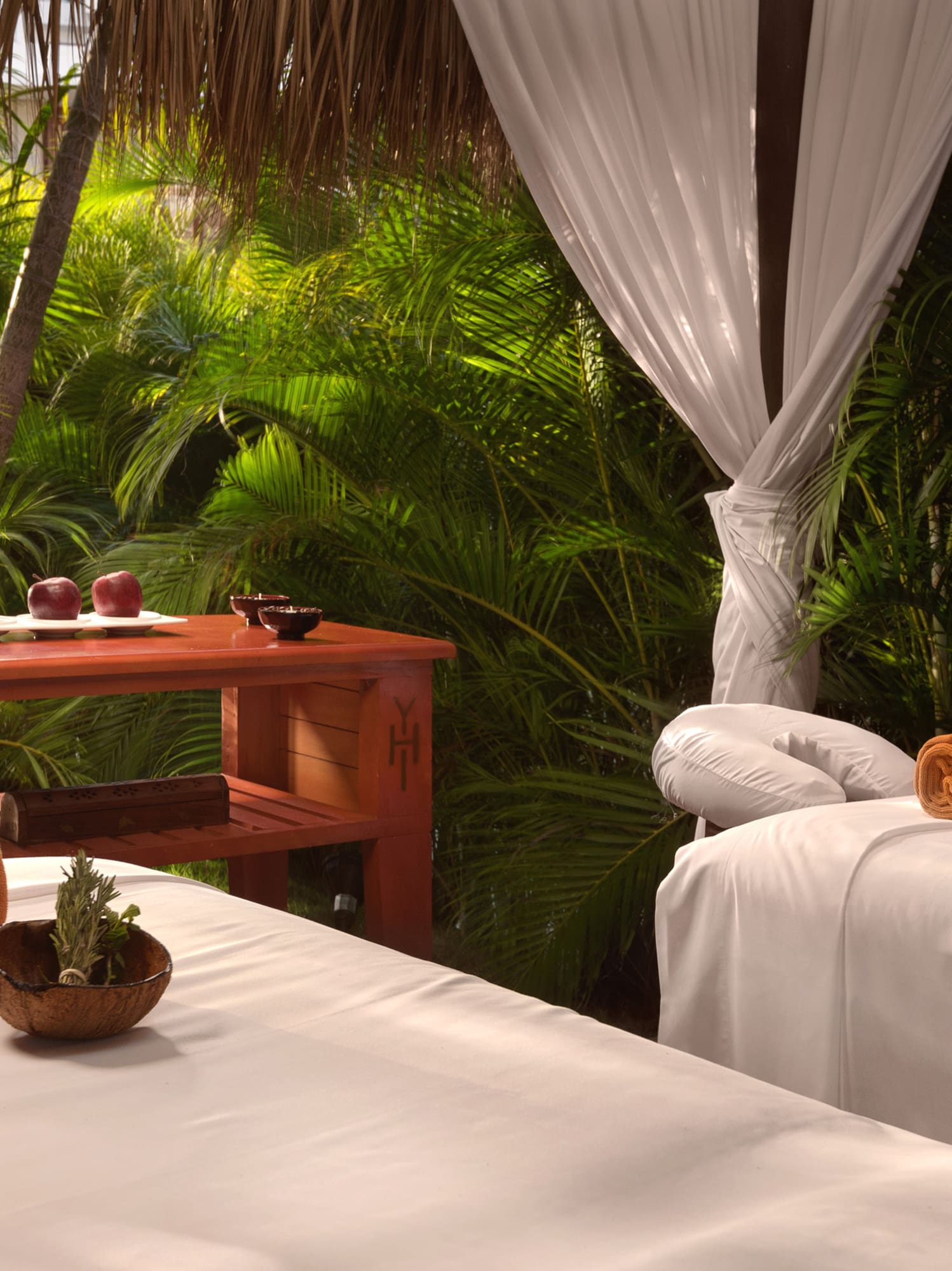 massage beds in a tropical setting