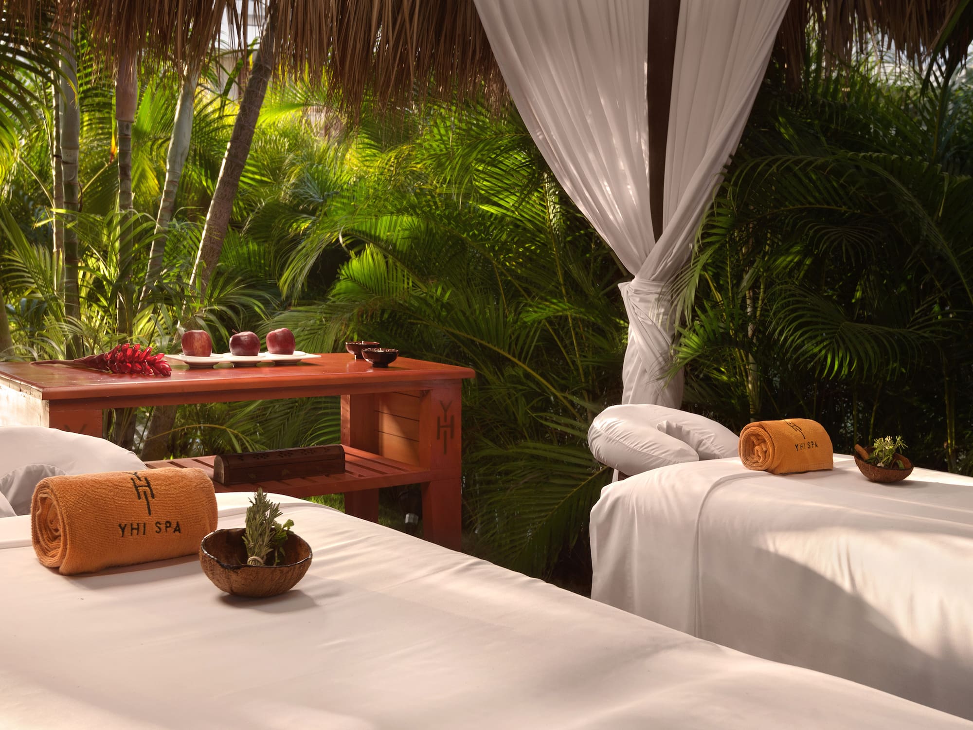 massage beds in a tropical setting