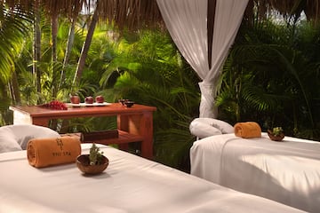 massage beds in a tropical setting
