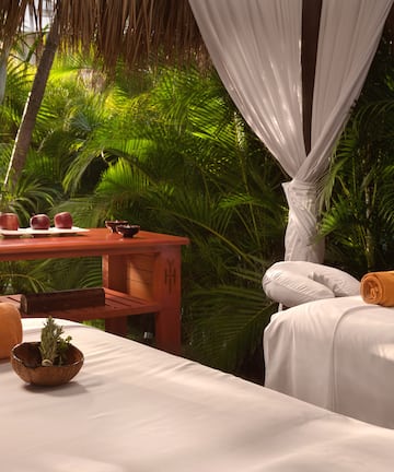 massage beds in a tropical setting