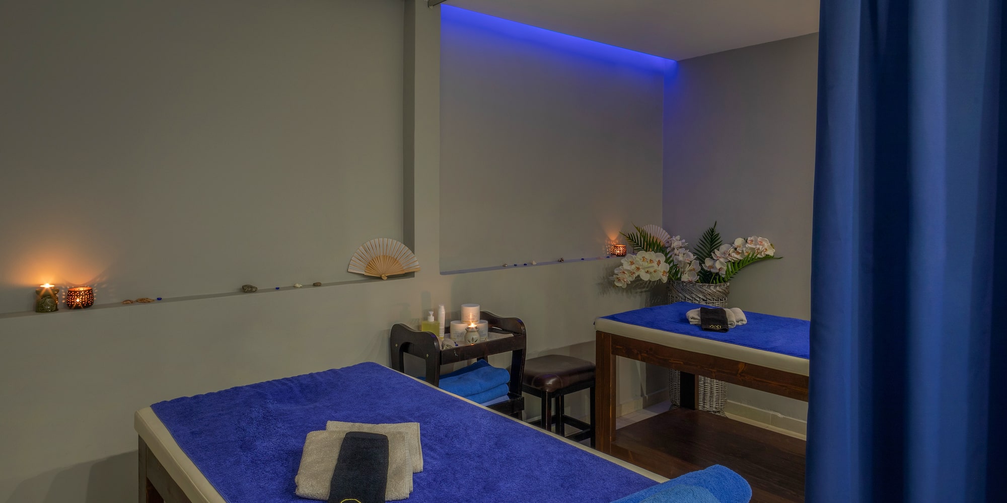 a massage table with blue towels and a towel on it