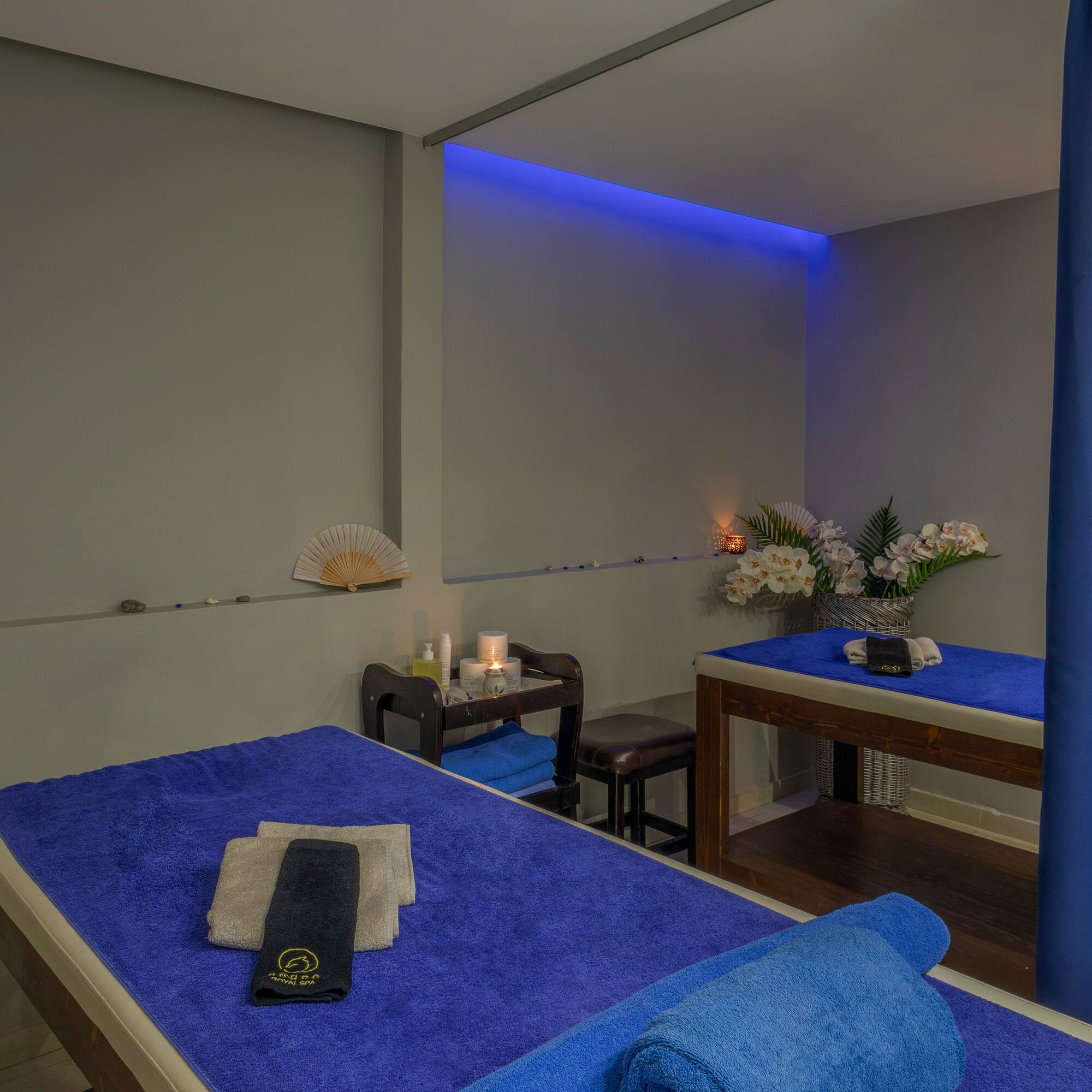 a massage table with blue towels and a towel on it