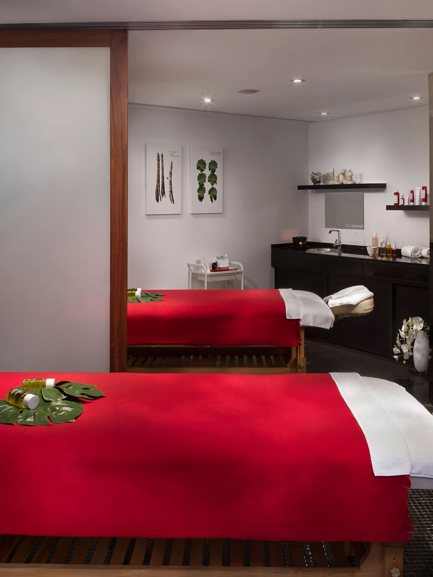 a room with two beds and a mirror