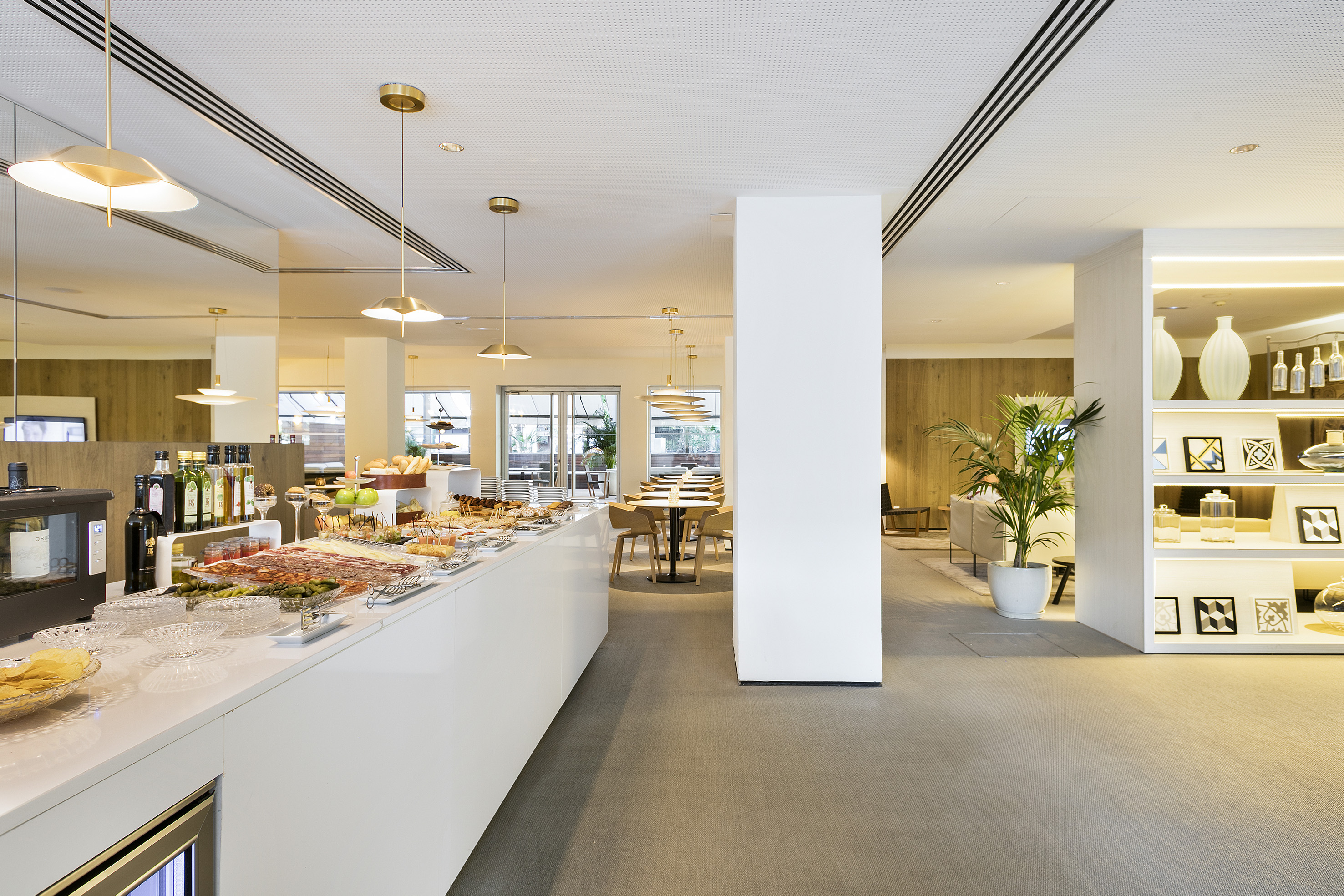 Modern hotel buffet spread in a contemporary dining room.