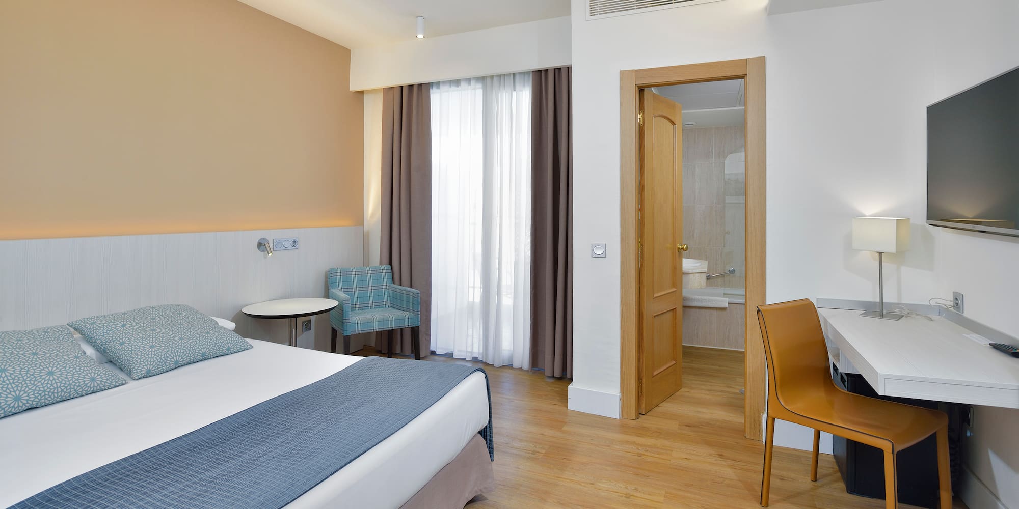 a room with a bed and a chair