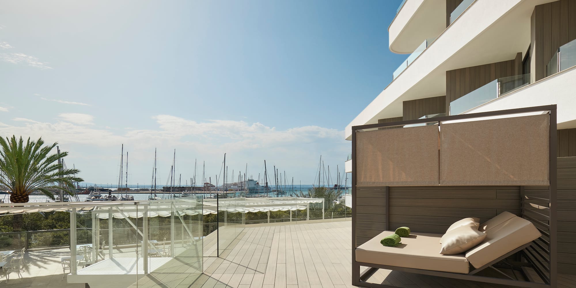 a deck with a couch and a view of the water