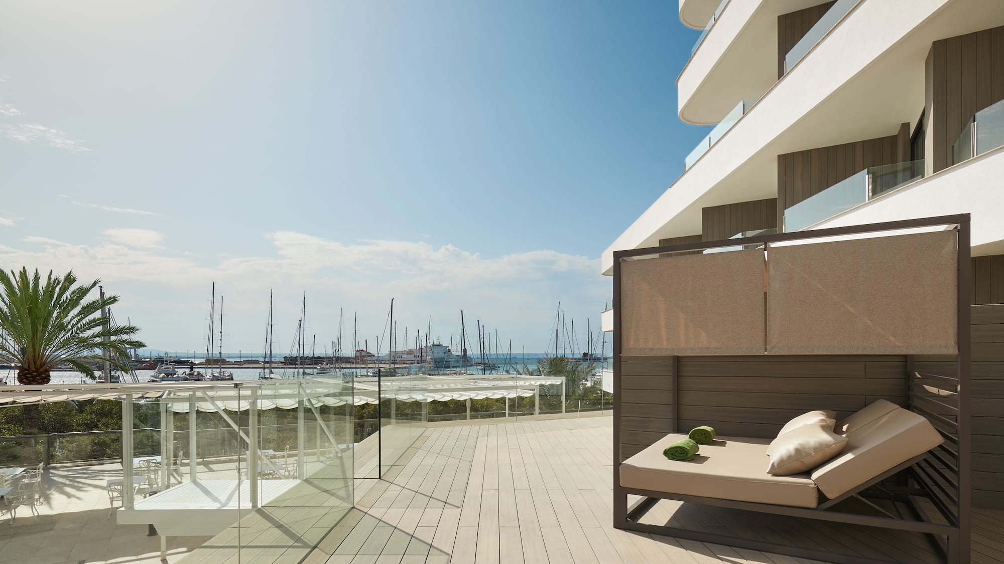a deck with a couch and a view of the water
