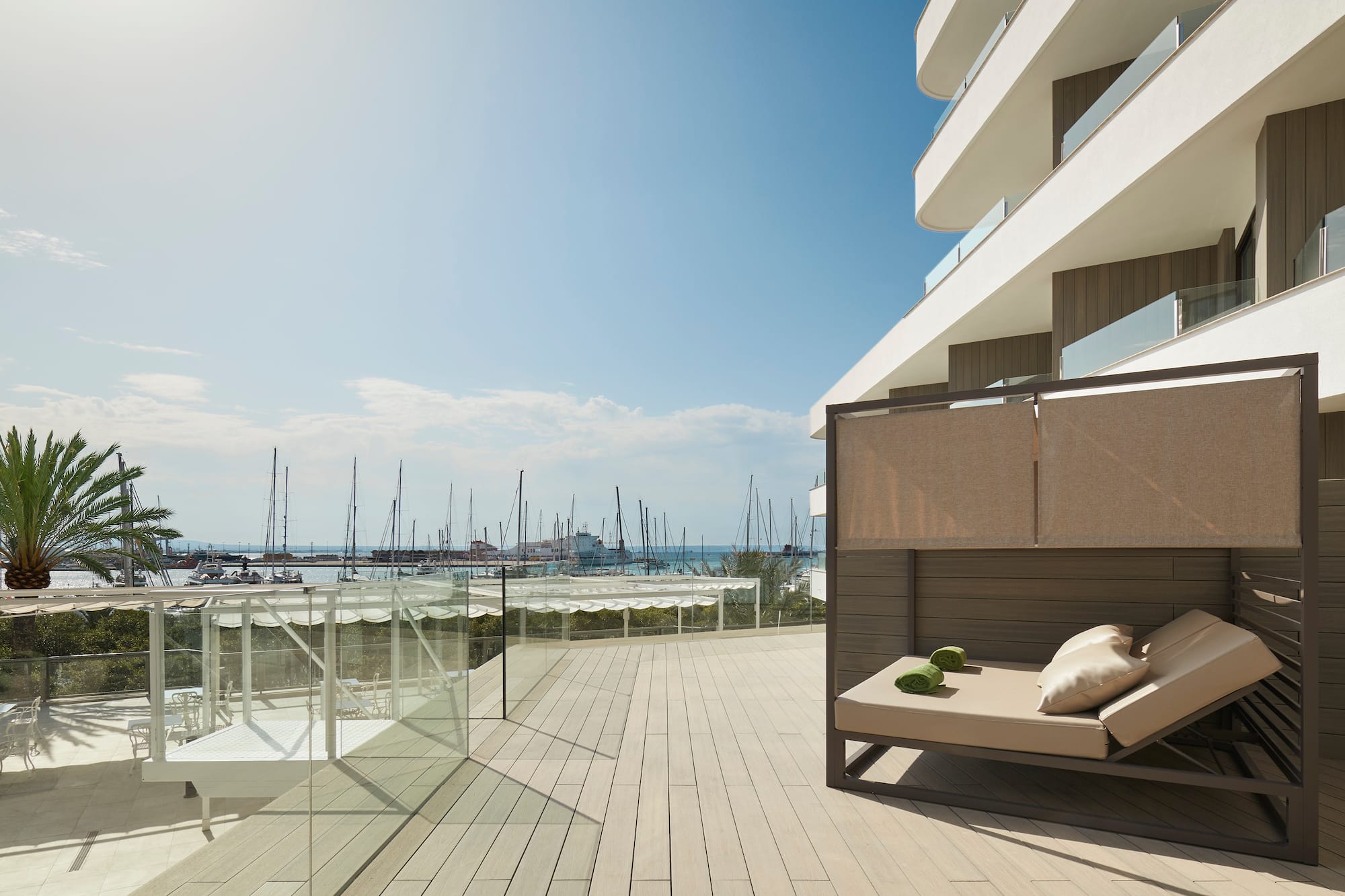 a deck with a couch and a view of the water
