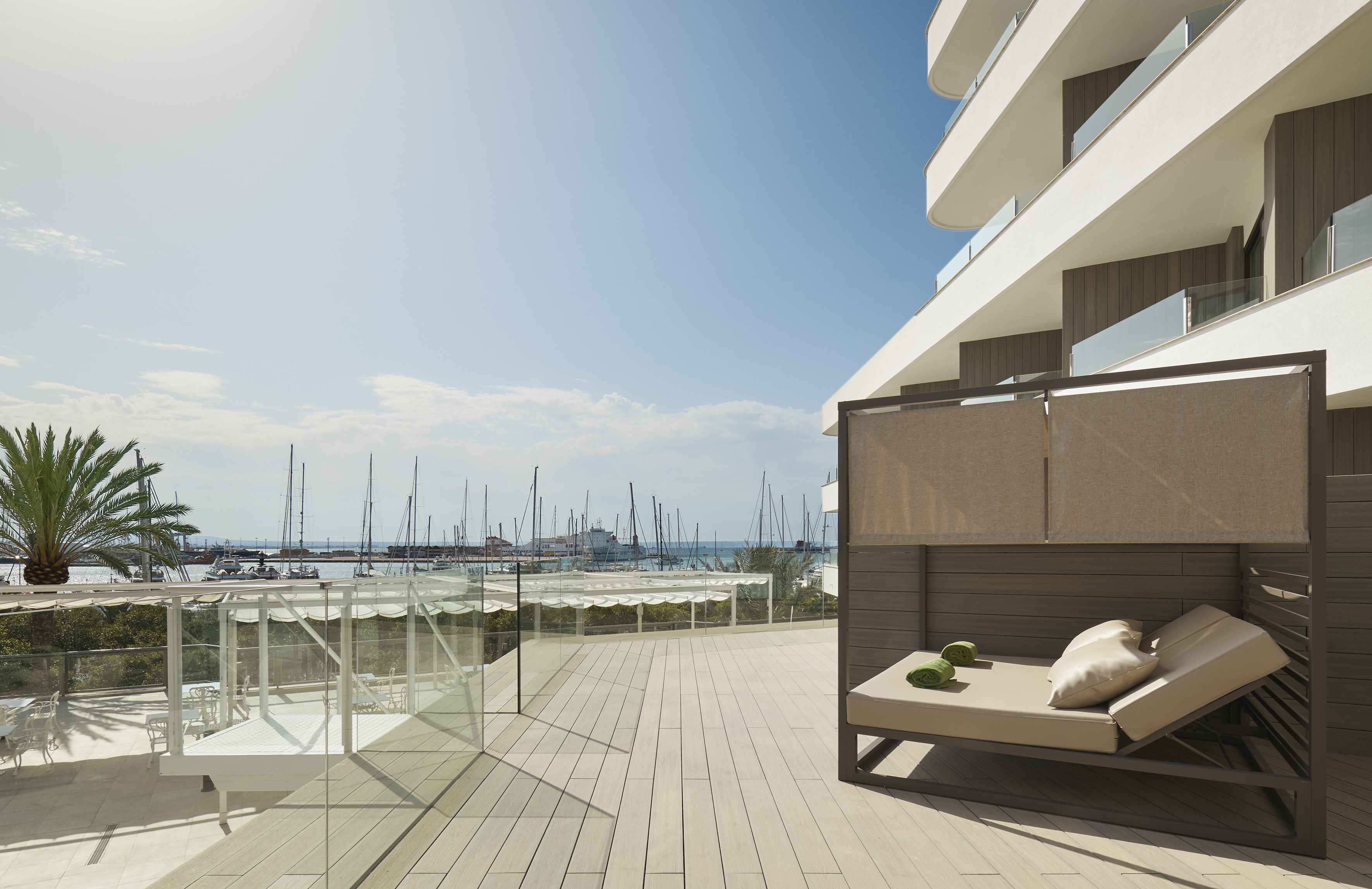 a deck with a couch and a view of the water