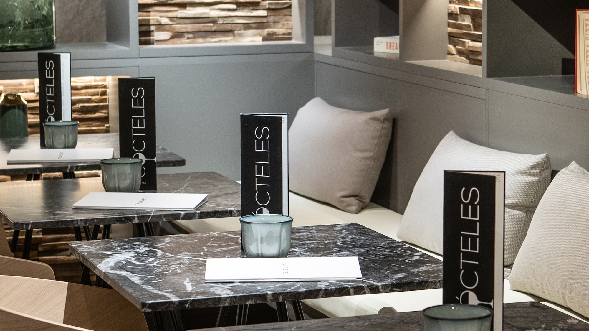 a table with chairs and a vase on it