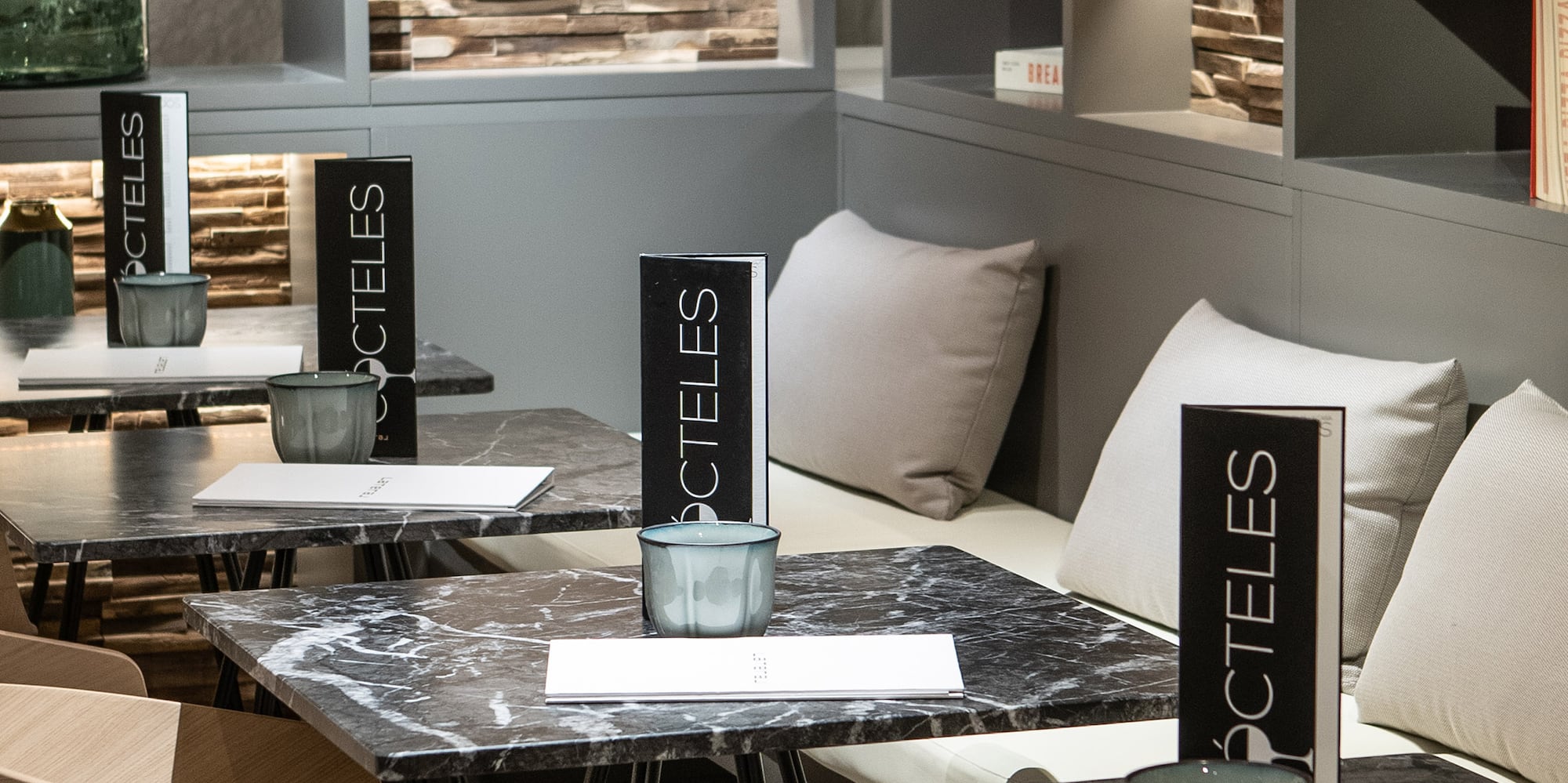 a table with chairs and a vase on it