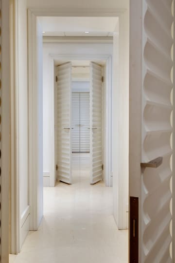 a white doorway with open doors