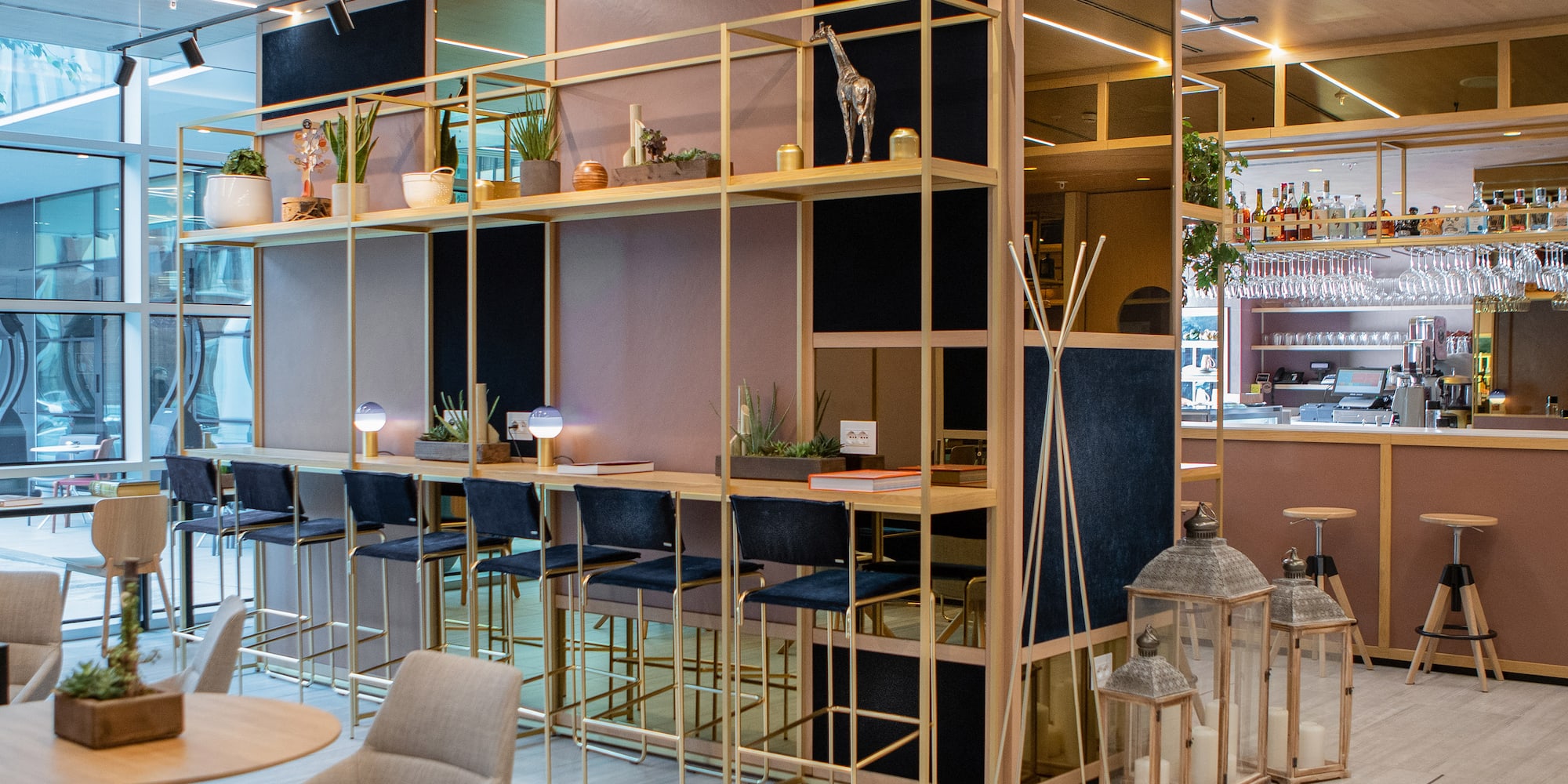 a room with a bar and chairs