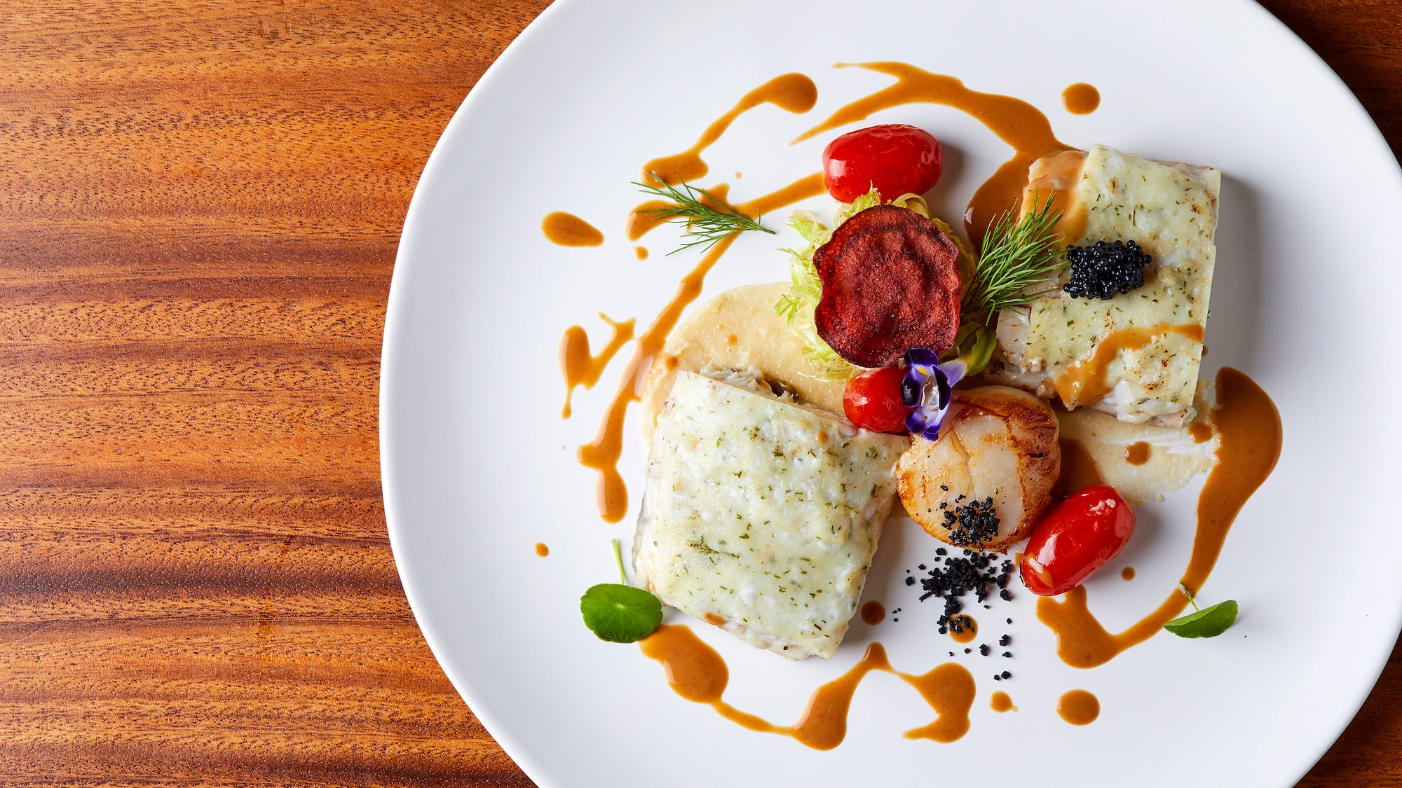 a plate of food on a wood table