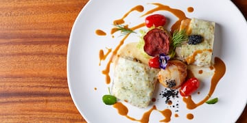 a plate of food on a wood table