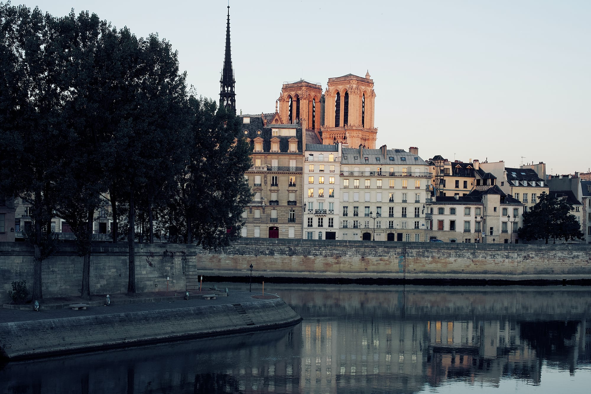 a body of water with buildings and trees