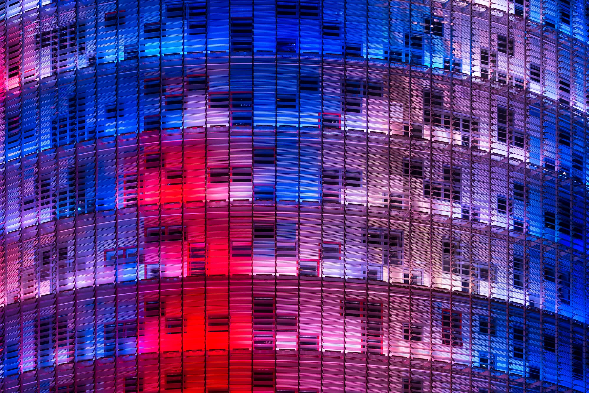 a multi colored building with many windows
