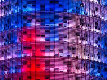 a multi colored building with many windows