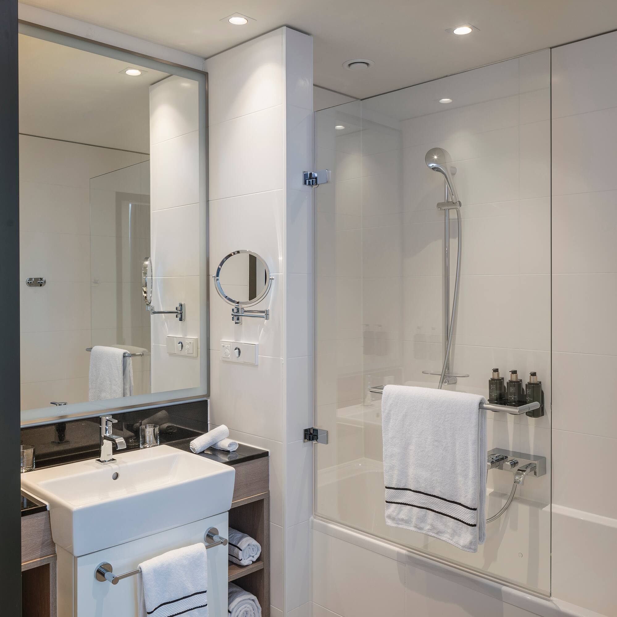 a bathroom with a shower and sink