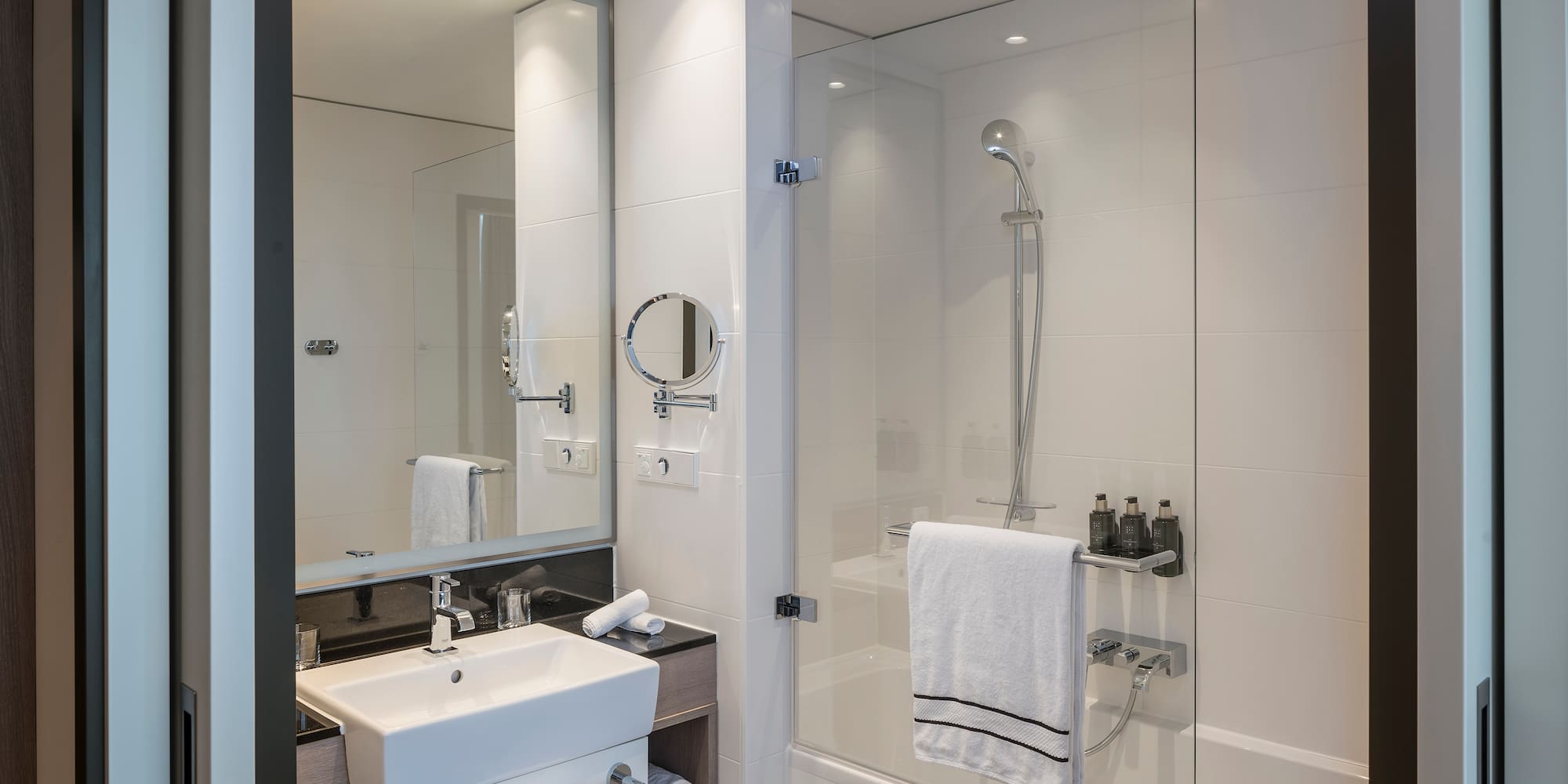 a bathroom with a shower and sink