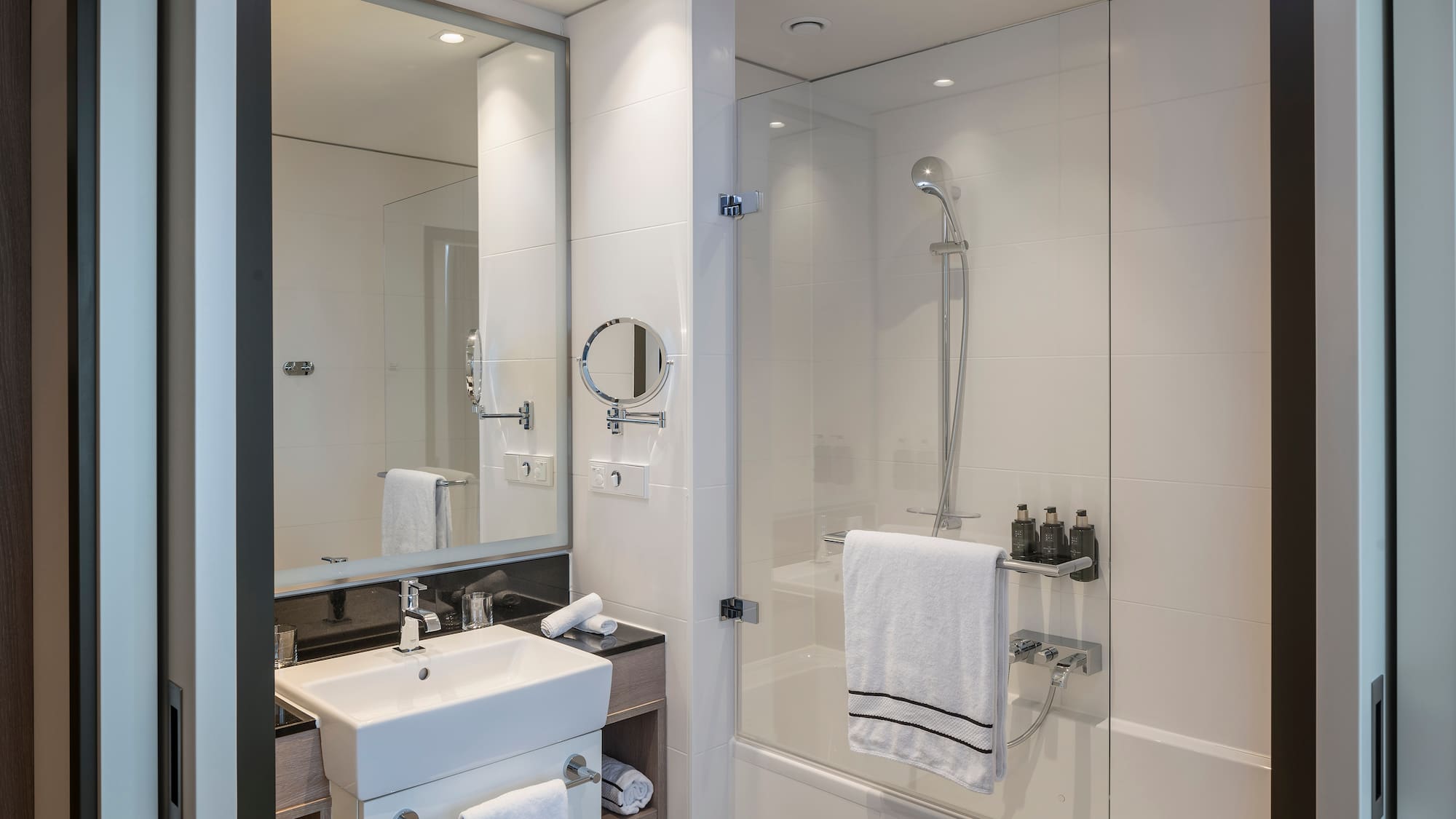 a bathroom with a shower and sink