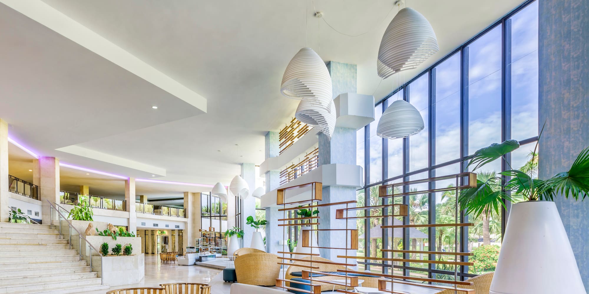 a large room with a large window and a large staircase