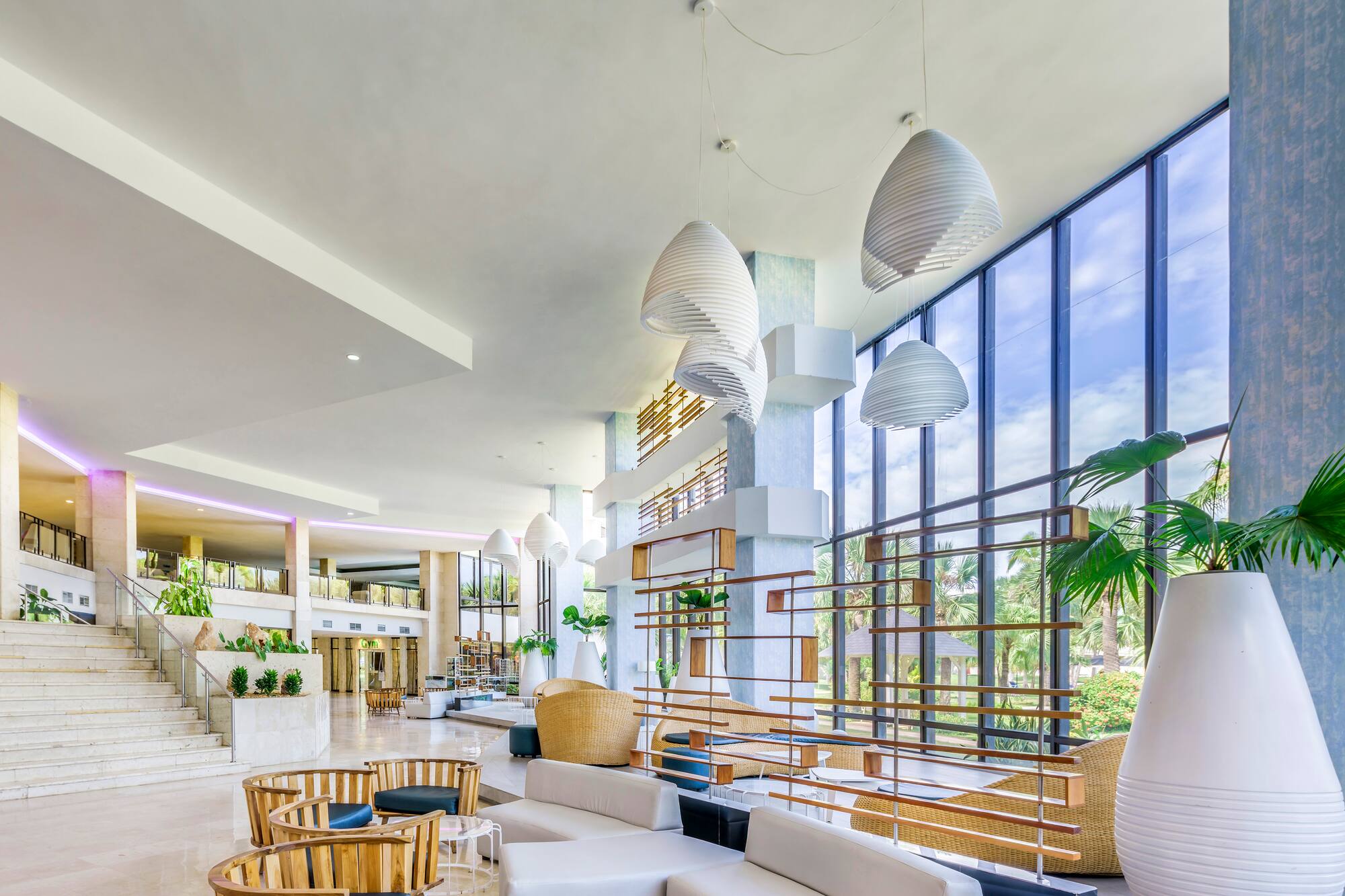 a large room with a large window and a large staircase