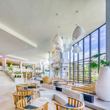 a large room with a large window and a large staircase