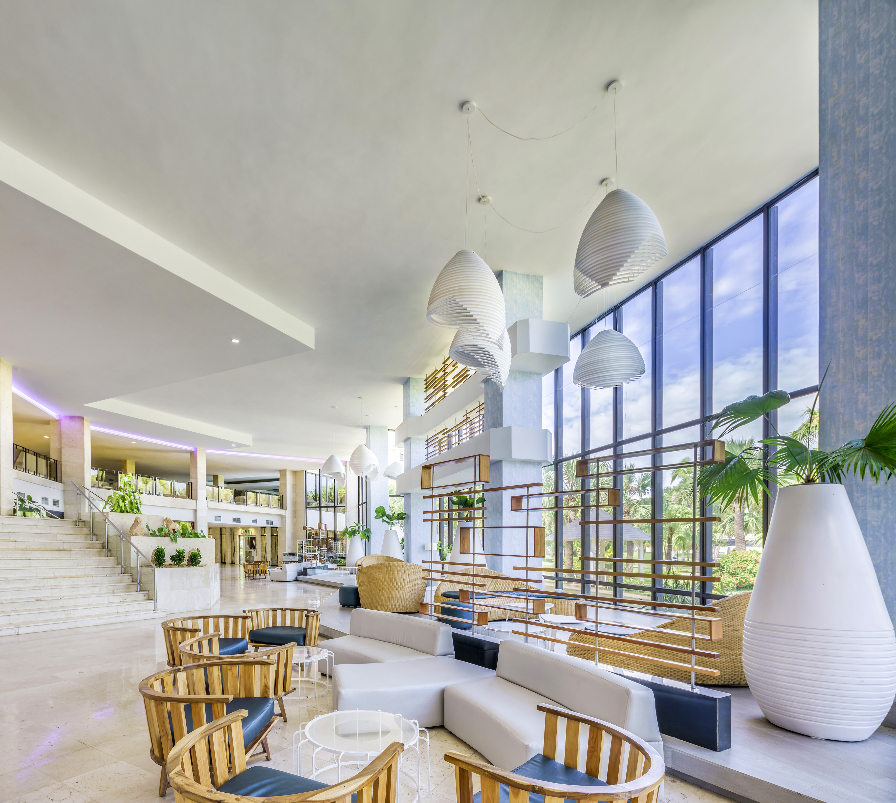 a large room with a large window and a large staircase