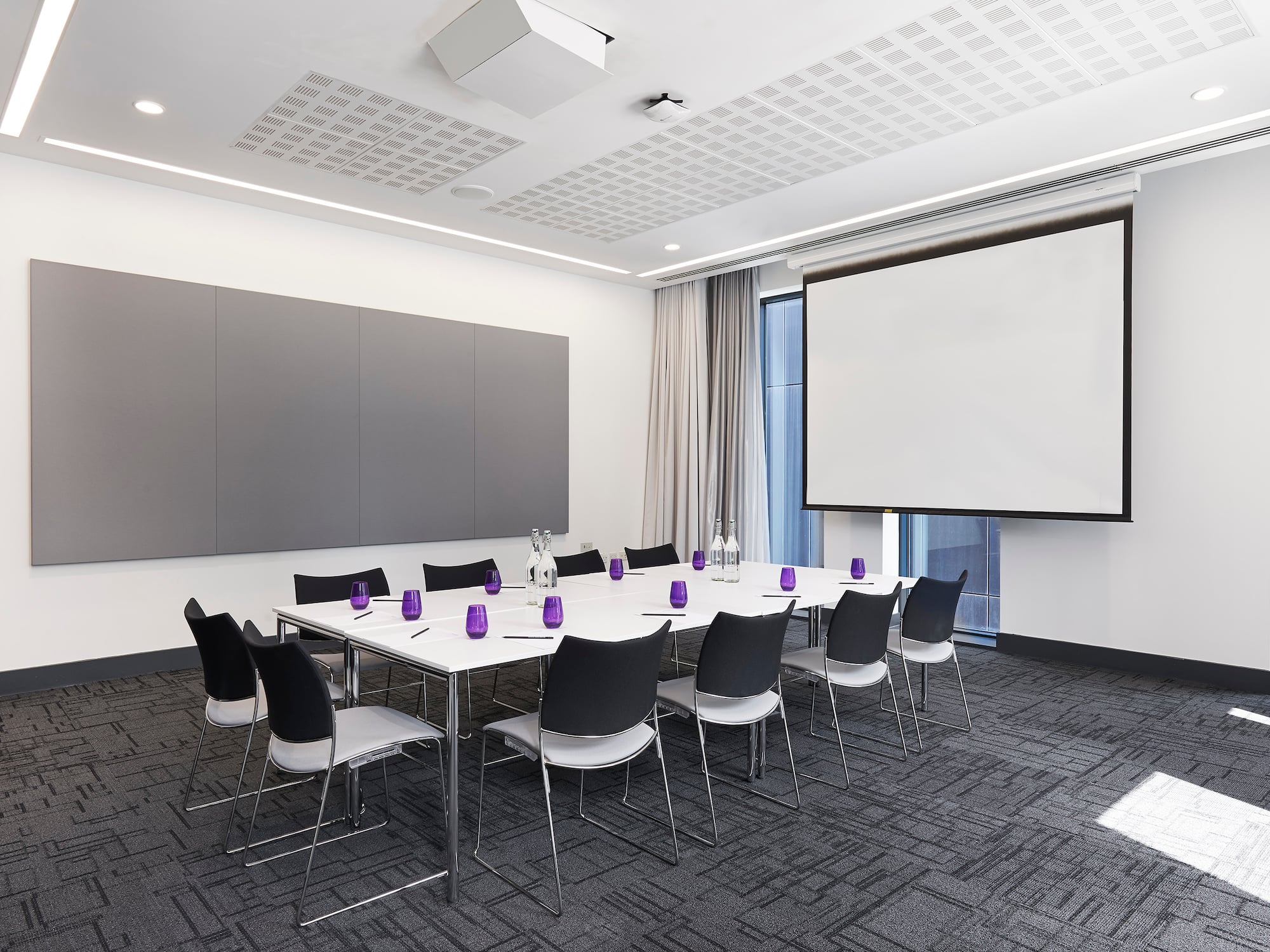 a room with a large projection screen