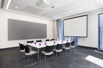 a room with a large projection screen