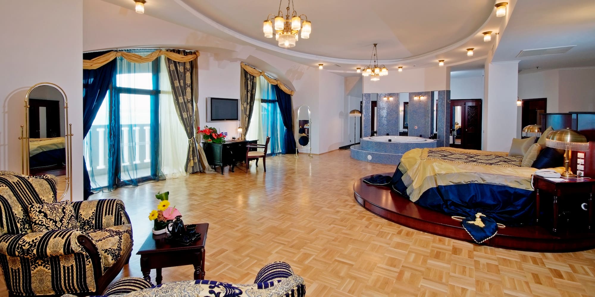 a room with a round bed and a jacuzzi