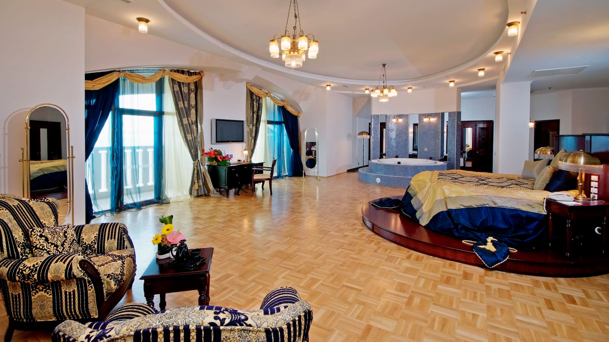 a room with a round bed and a jacuzzi