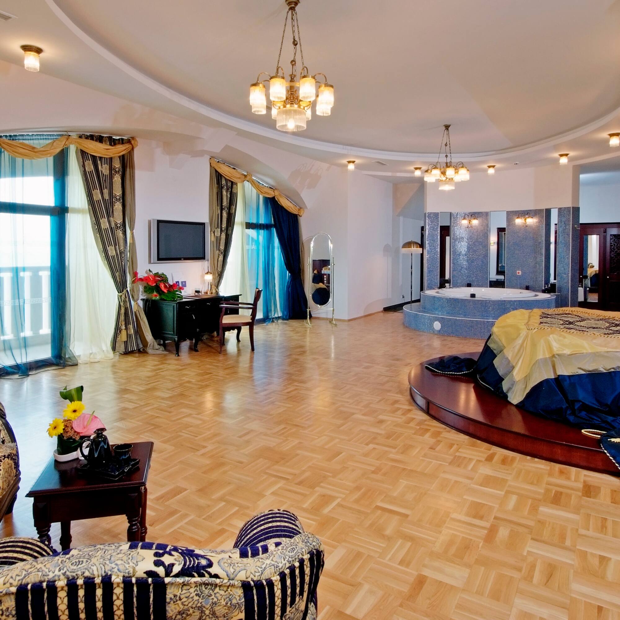 a room with a round bed and a jacuzzi