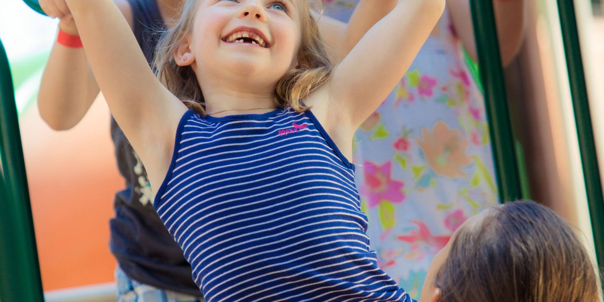 a group of kids playing on a playground