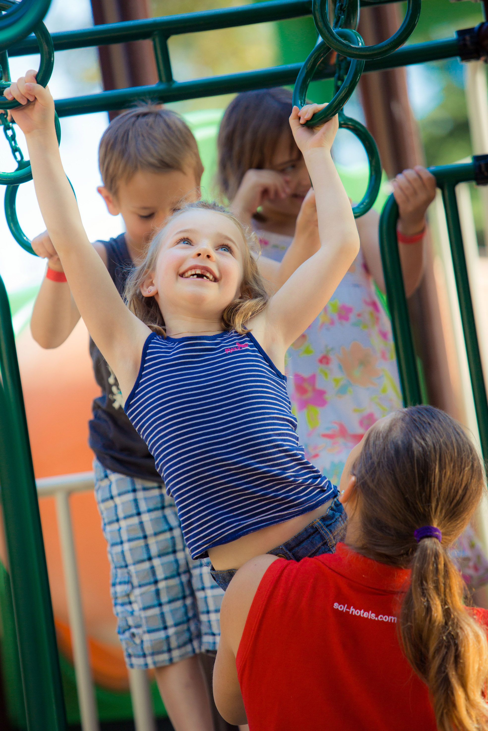 a group of kids playing on a playground