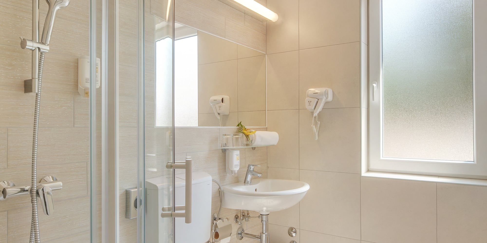 a bathroom with a shower and toilet