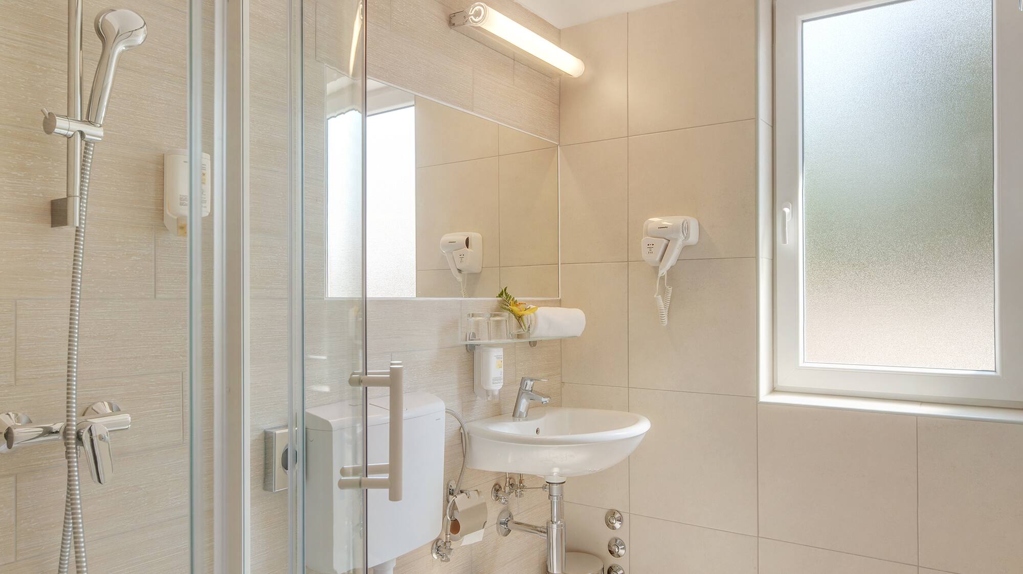 a bathroom with a shower and toilet