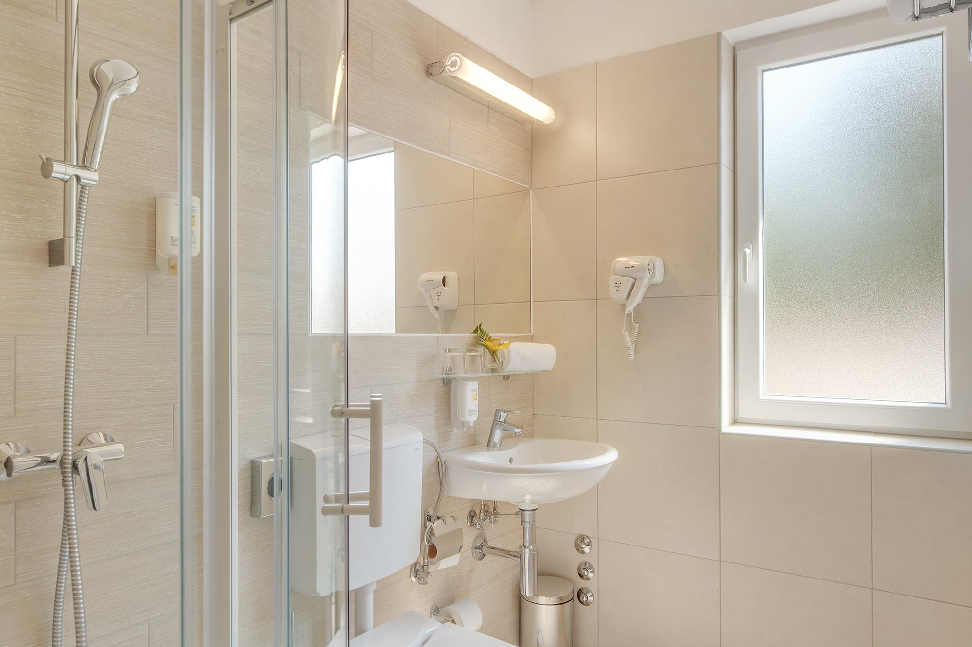 a bathroom with a shower and toilet
