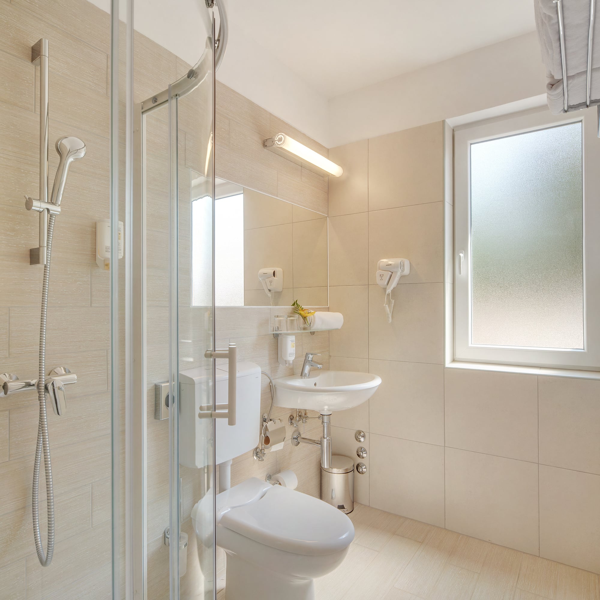 a bathroom with a shower and toilet