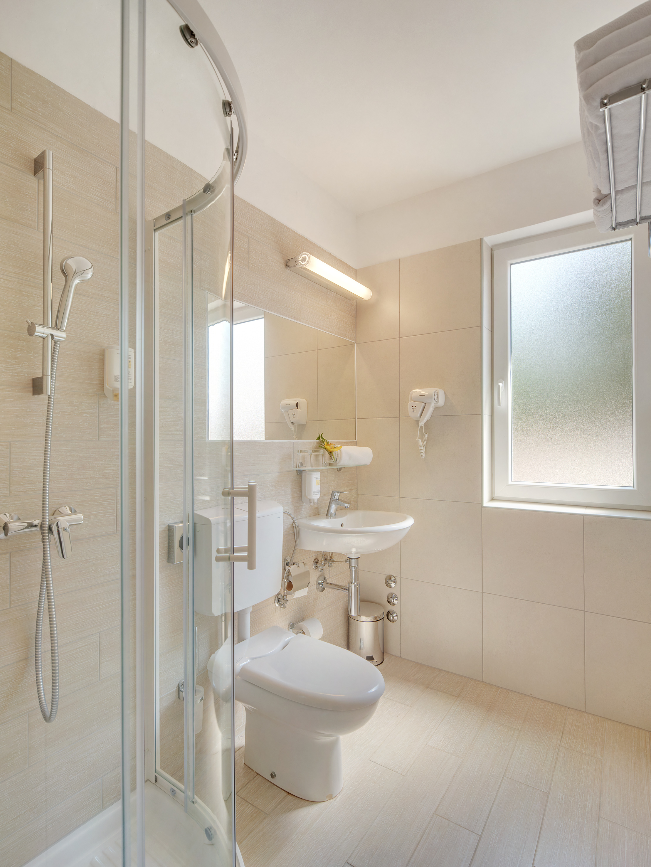 a bathroom with a shower and toilet