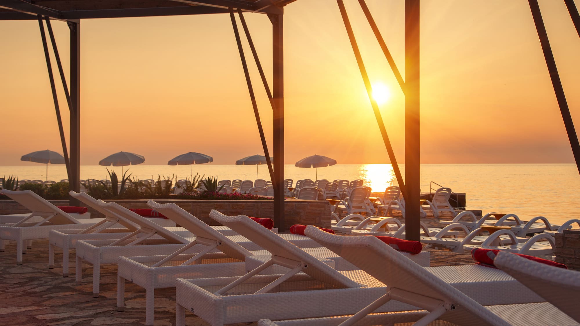 a group of chairs on a beach
