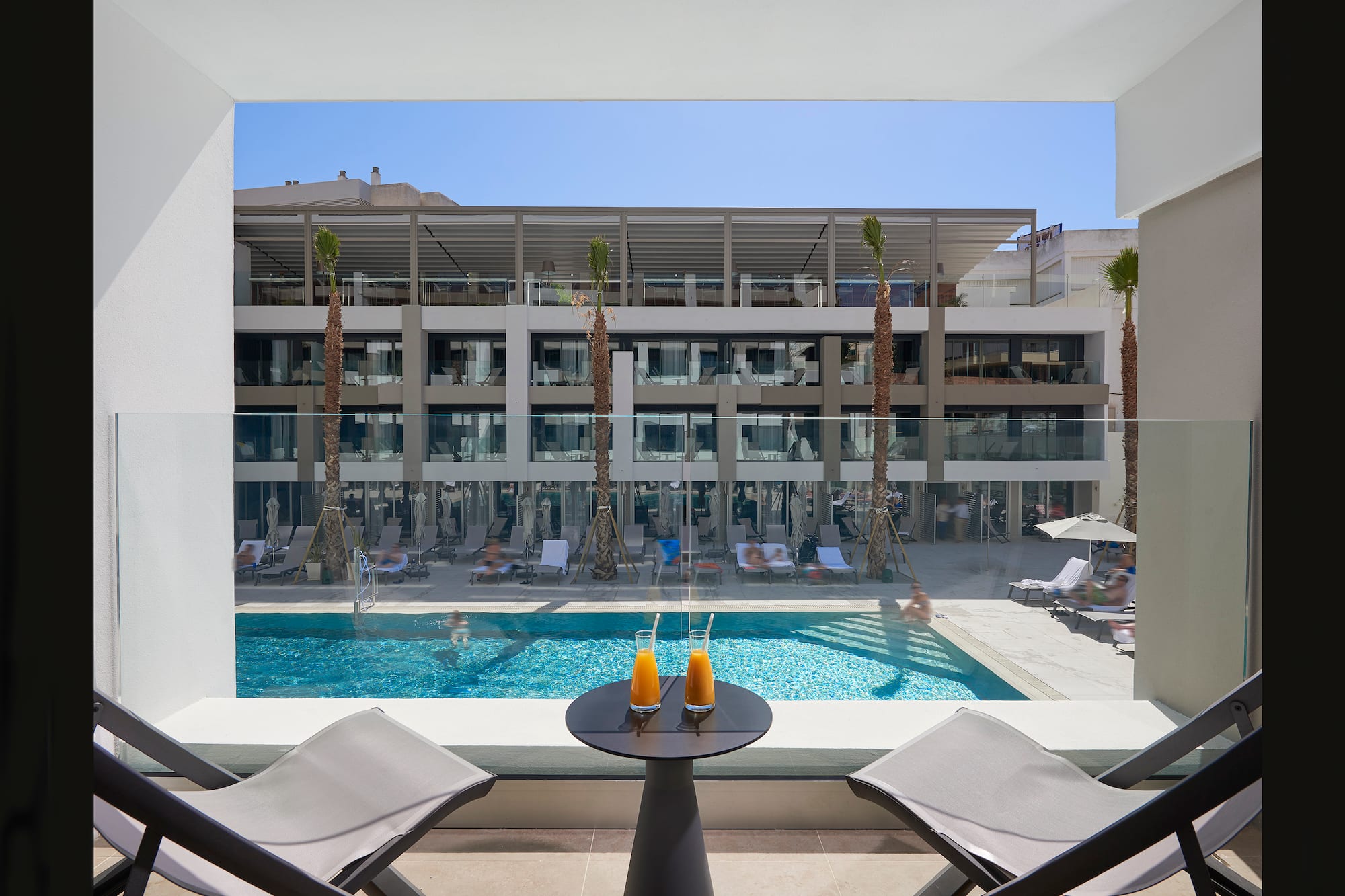 a pool with a table and chairs