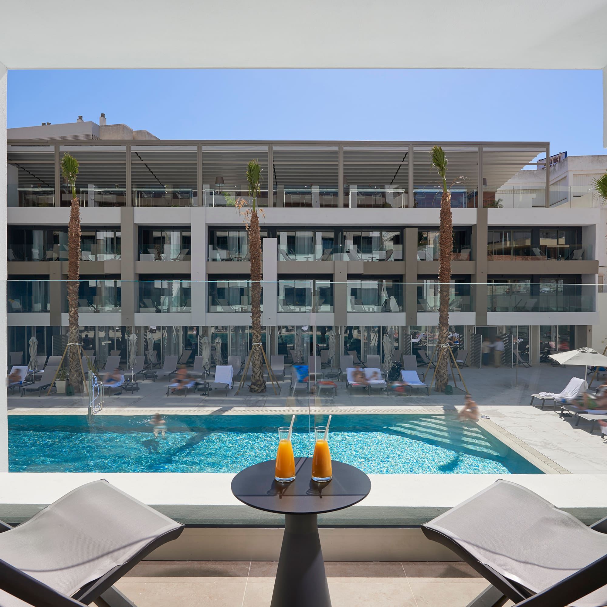 a pool with a table and chairs
