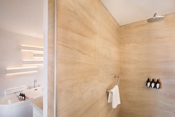 a bathroom with a shower and a bathtub