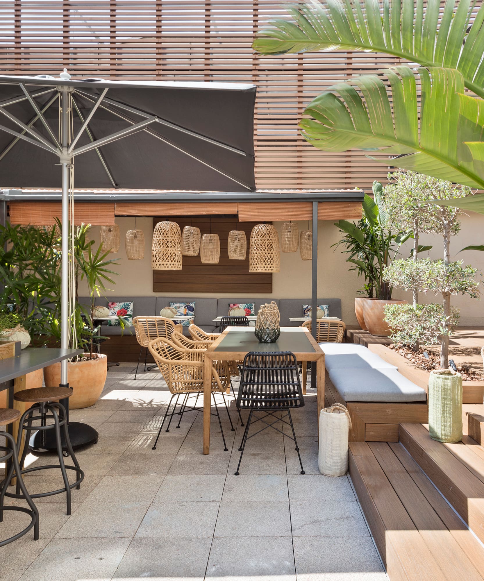 a patio with chairs and tables