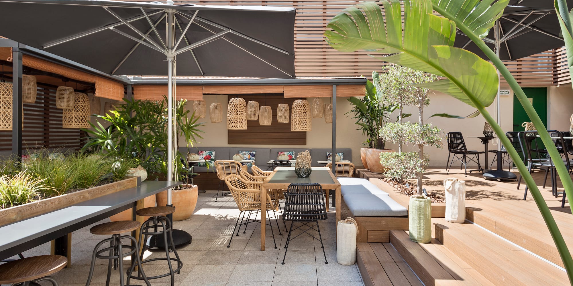 a patio with chairs and tables