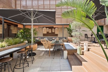 a patio with chairs and tables