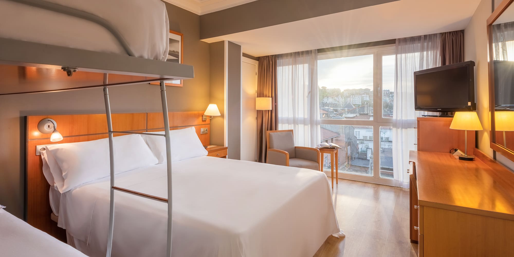 a room with bunk beds and a television